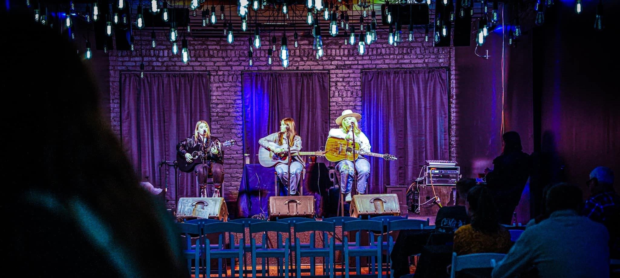 A picture of three performers playing at Venue220